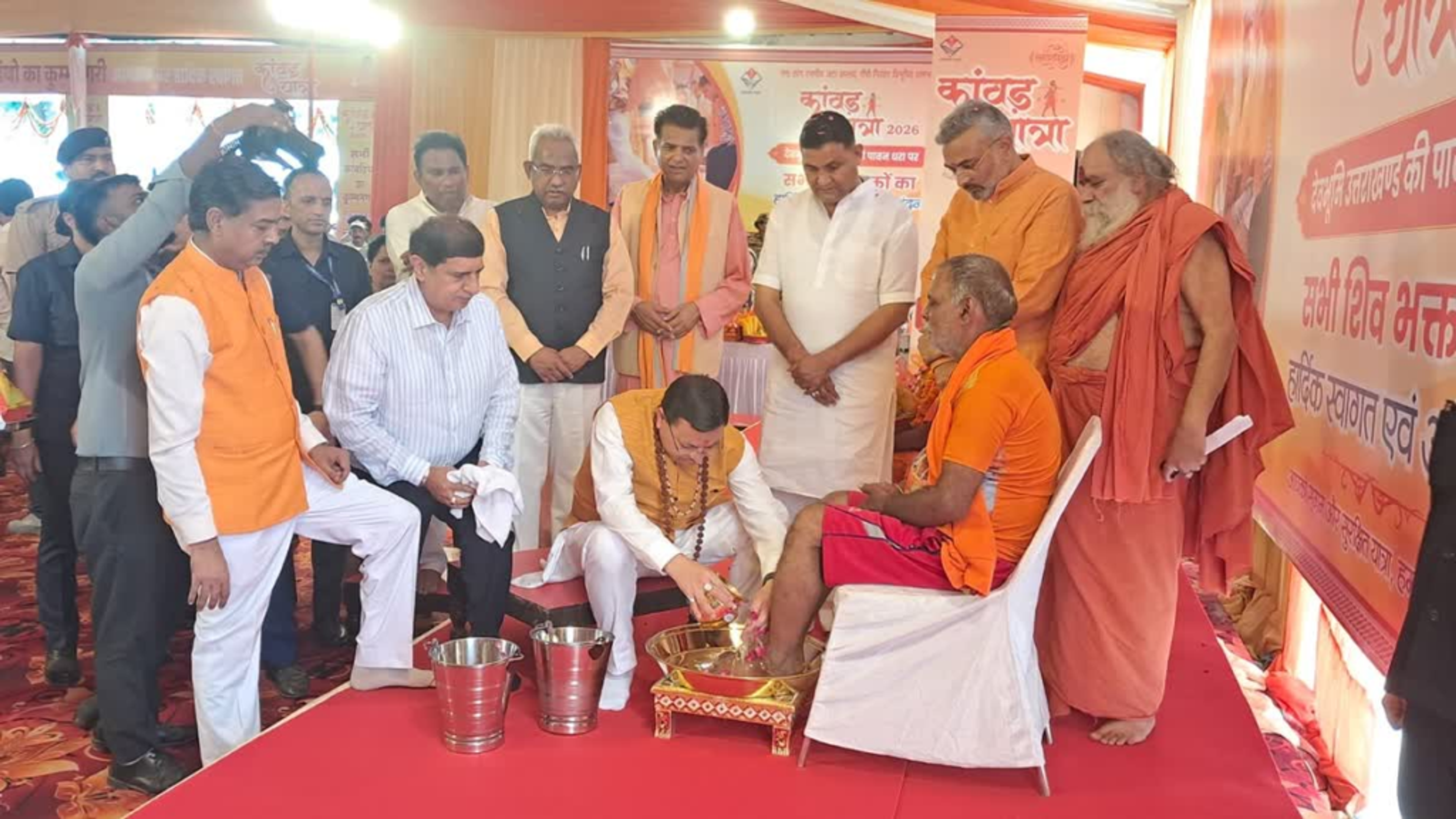 CM Dhami Showers Flowers on Kanwariyas from Helicopter in Haridwar, Washes Devotees’ Feet: Says ‘Over 1 Crore Shiva Devotees Have Taken Gangajal’