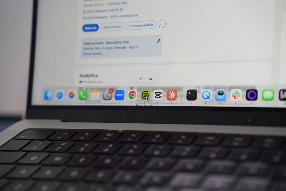 Close-up of the MacBook Pro screen showing a LinkedIn profile, with Granola highlighted in the macOS dock below