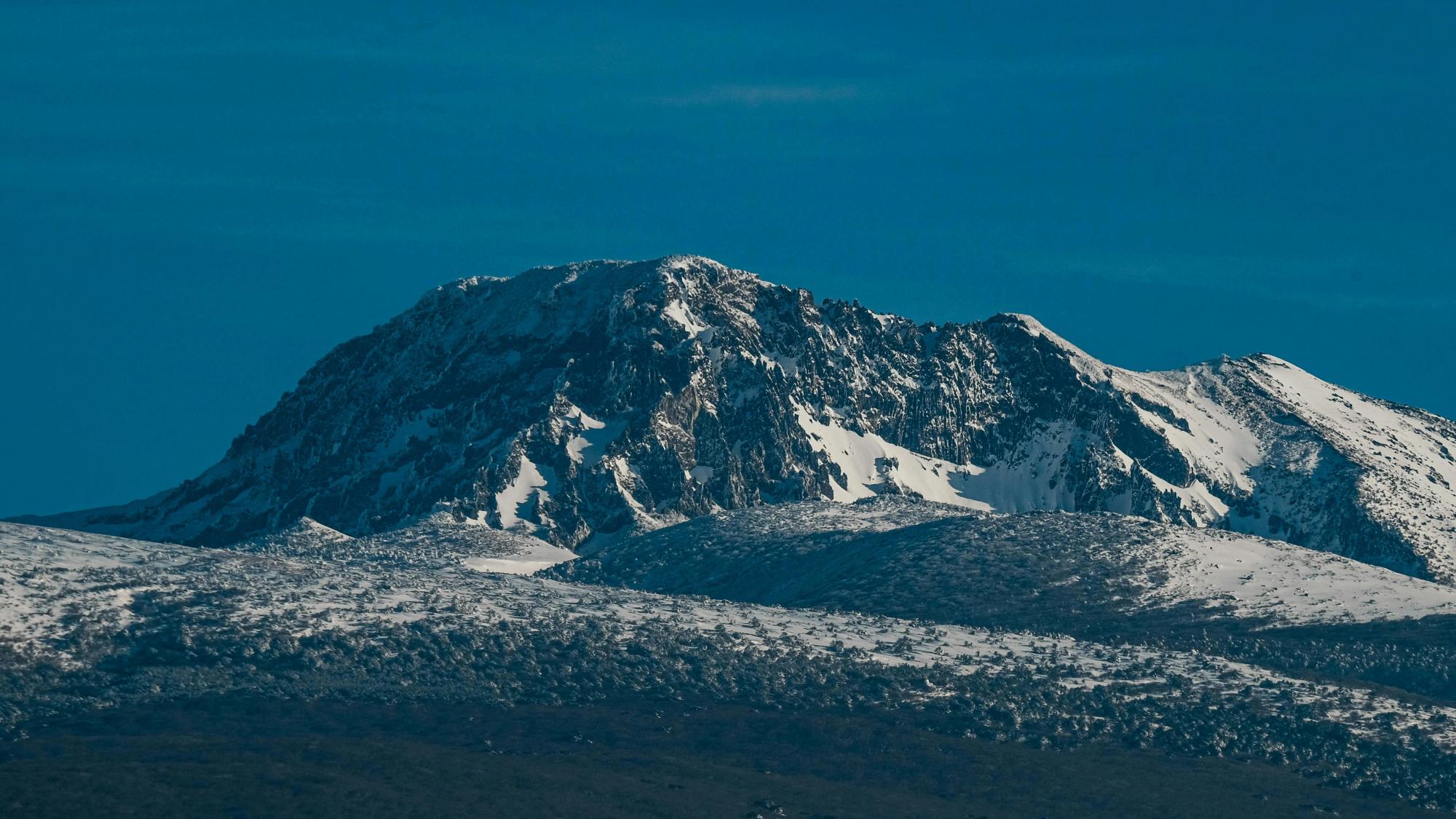 Snow-covered summit ridge of Hallasan under a deep blue winter sky, Jeju Island
