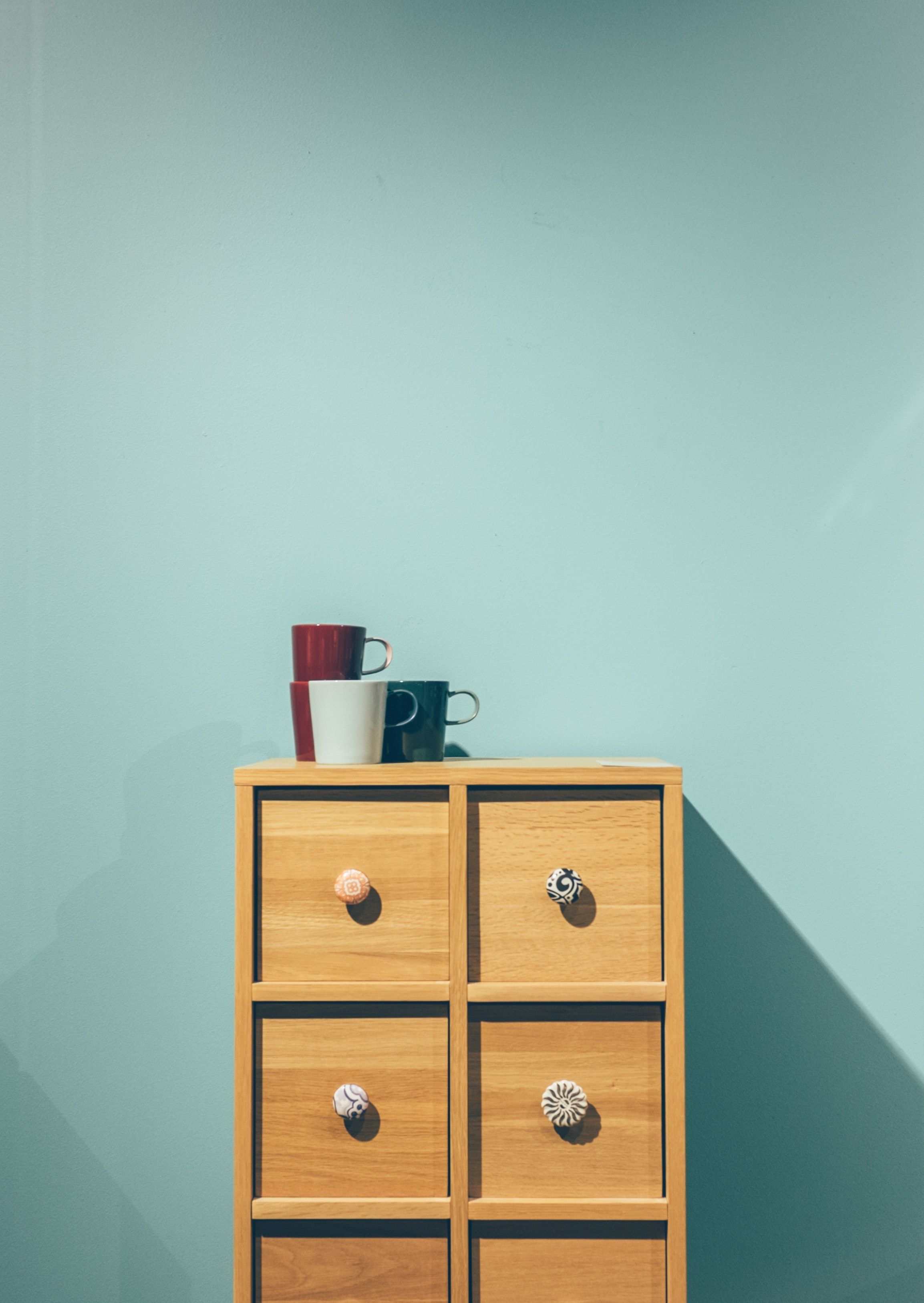 Wooden dresser with cups