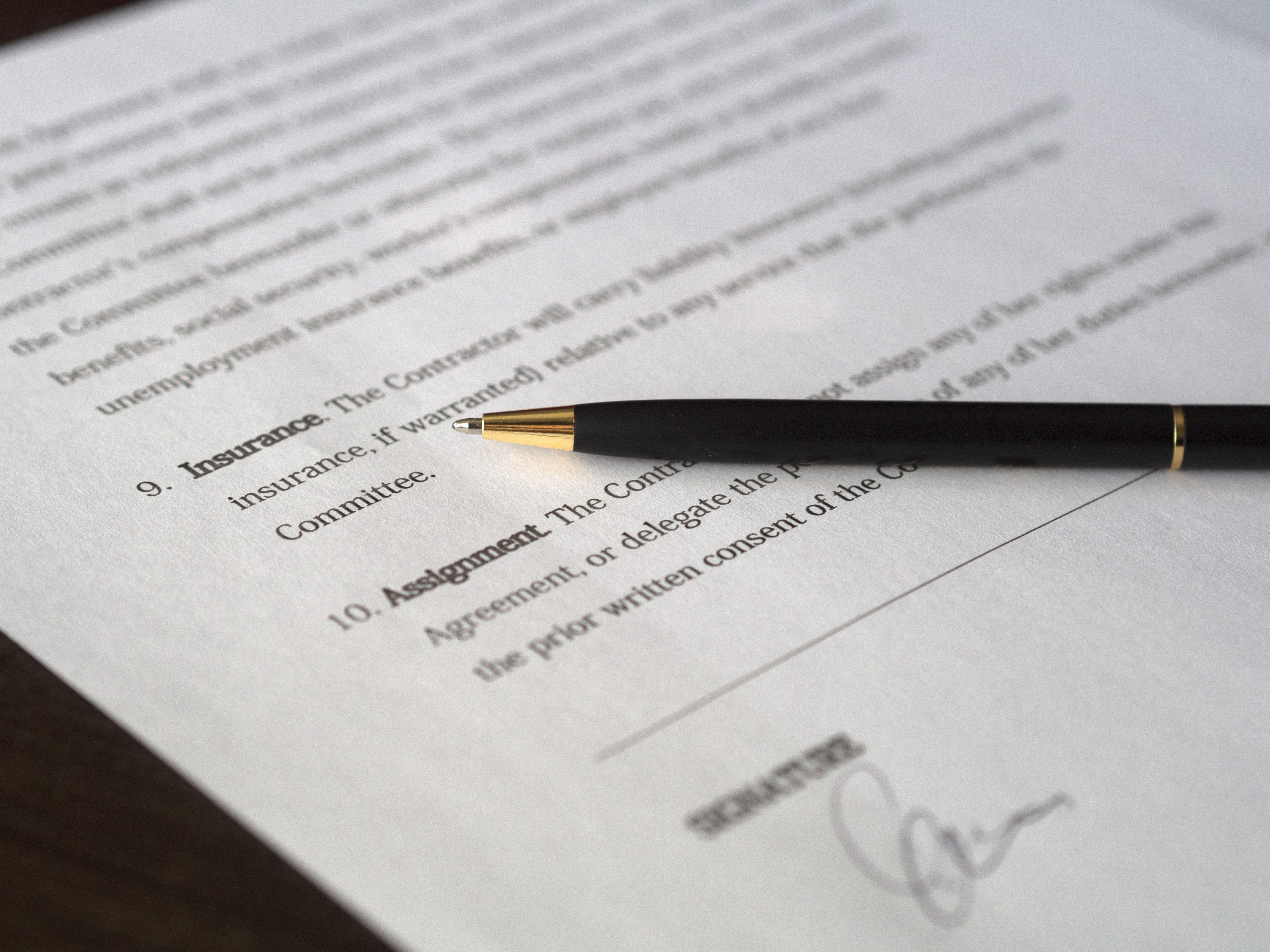 A stock option contract with a pen on it