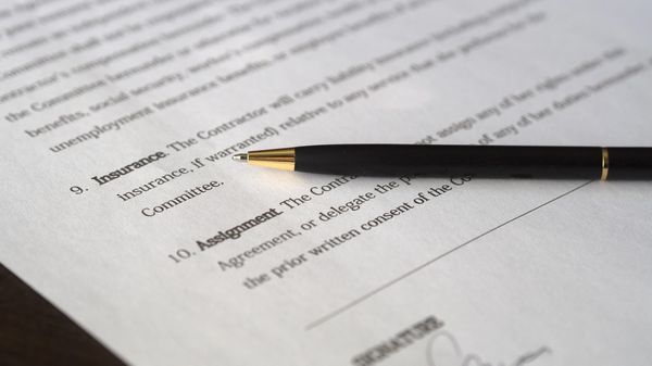 A stock option contract with a pen on it