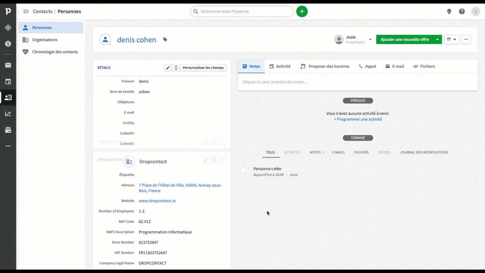 A CRM contact record enriched by Dropcontact with company details, as shown on its G2 listing.