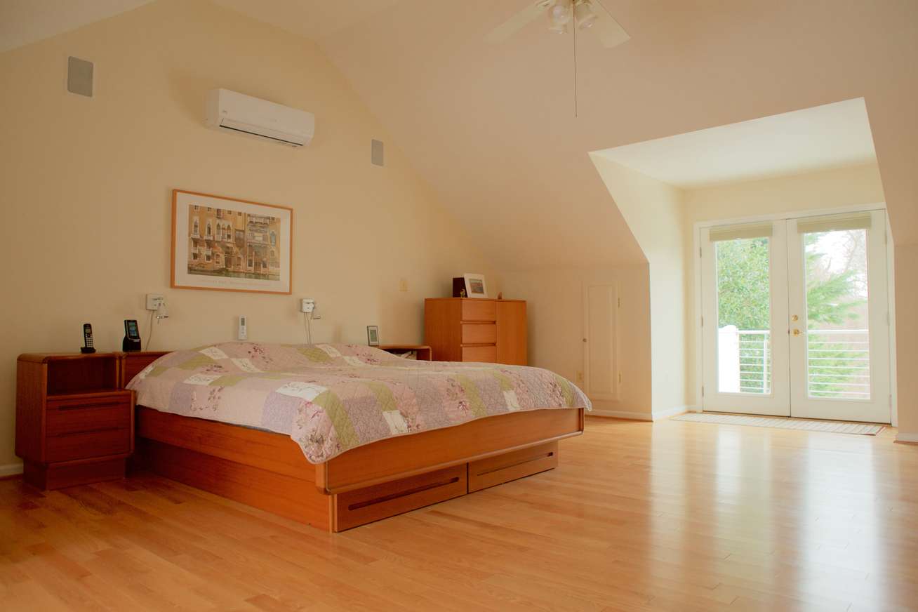 Master Bedroom renovation in Columbia, MD showing improved morning window light and balcony