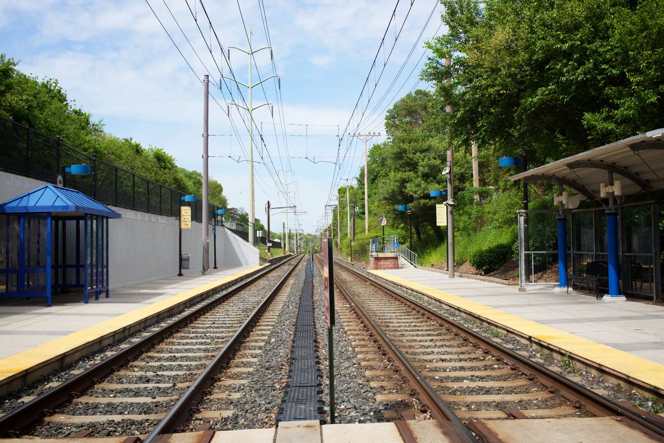 MTA Linthicum station view of tracks with new pavilions on north and south-bound platforms and retaining wall on west side. Linthicum Heights, MD.