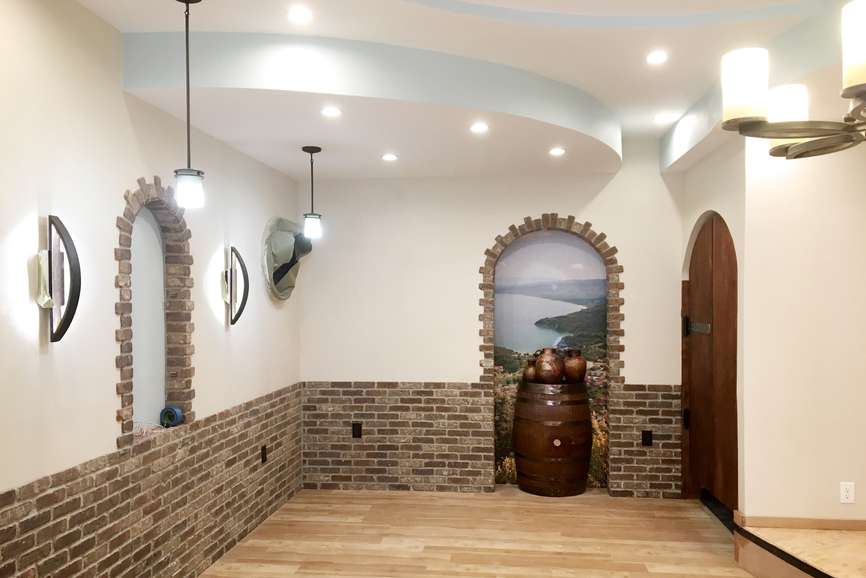 Troika Restaurant main dining area under construction (with stage on the right) featuring several display nooks, ceiling and light detail