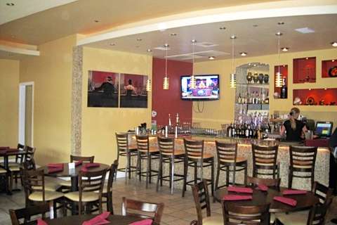 Nostalgia Bistro in Rockville, MD bar view from main dining area featuring ceiling and lighting detail