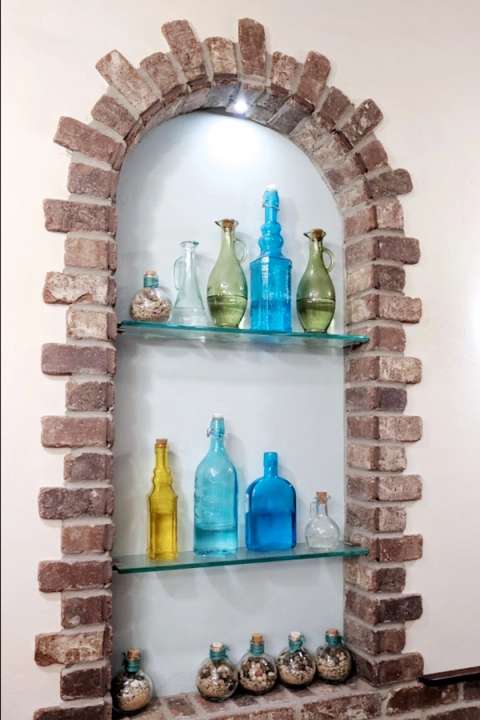 Troika Restaurant display nook with bottles