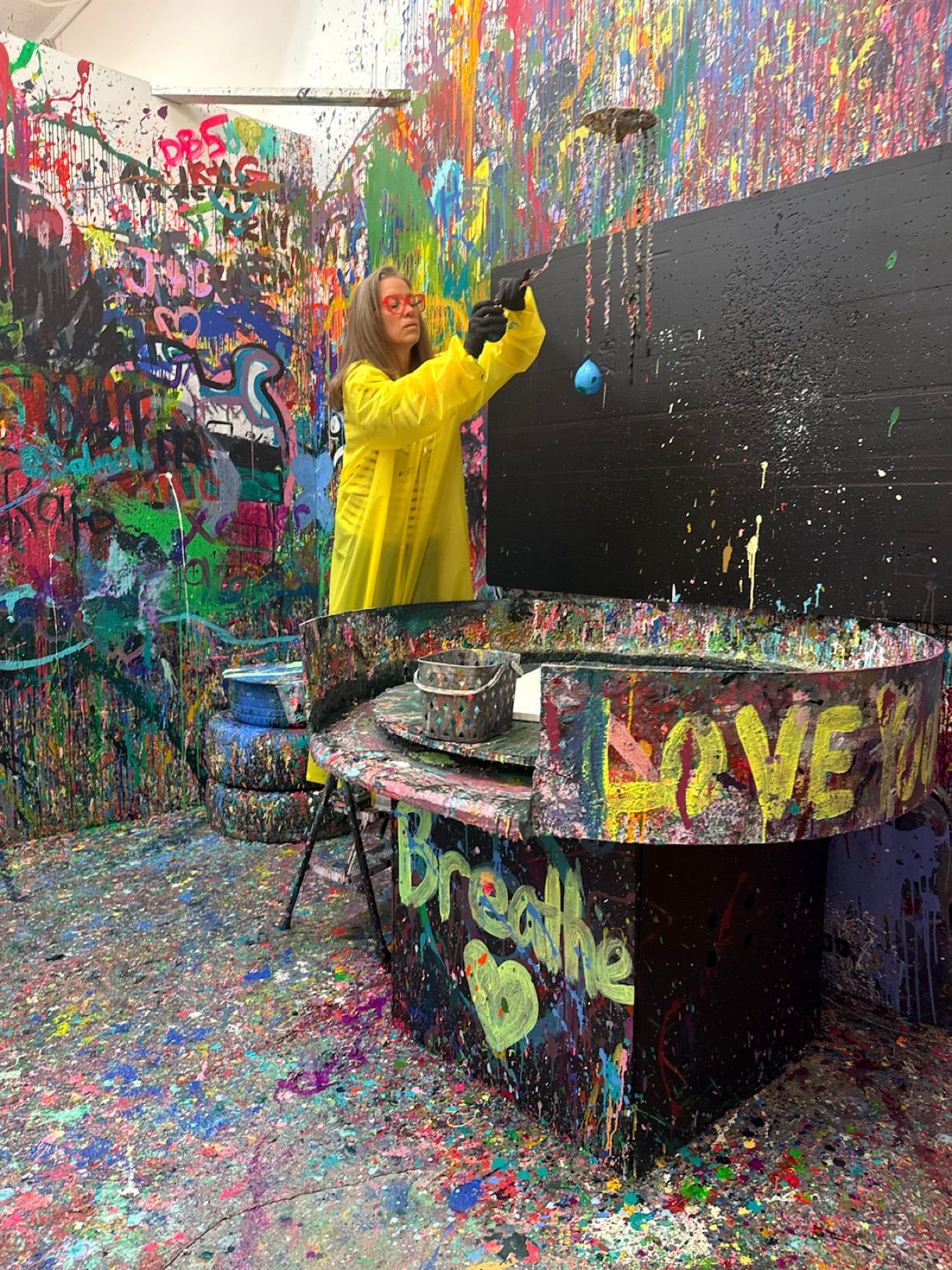 Carisa exploring a colorful art studio in the Los Angeles Arts District