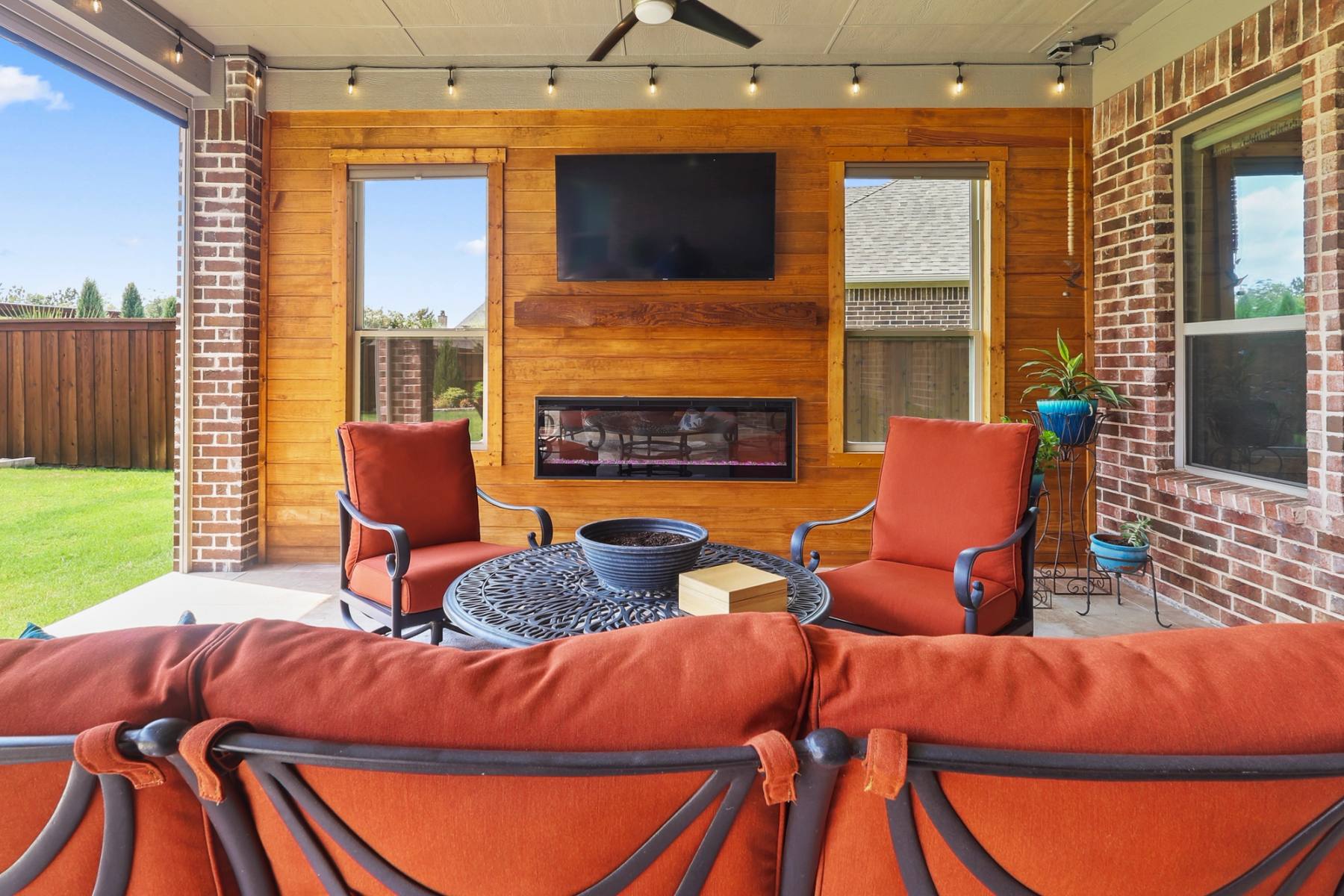 Under a patio cover we built, looking out to the yard, The Colony. Built by True Star Outdoor Solutions.