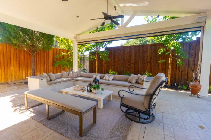 Built-in seating under a white gable cover, Plano. Built by True Star Outdoor Solutions.
