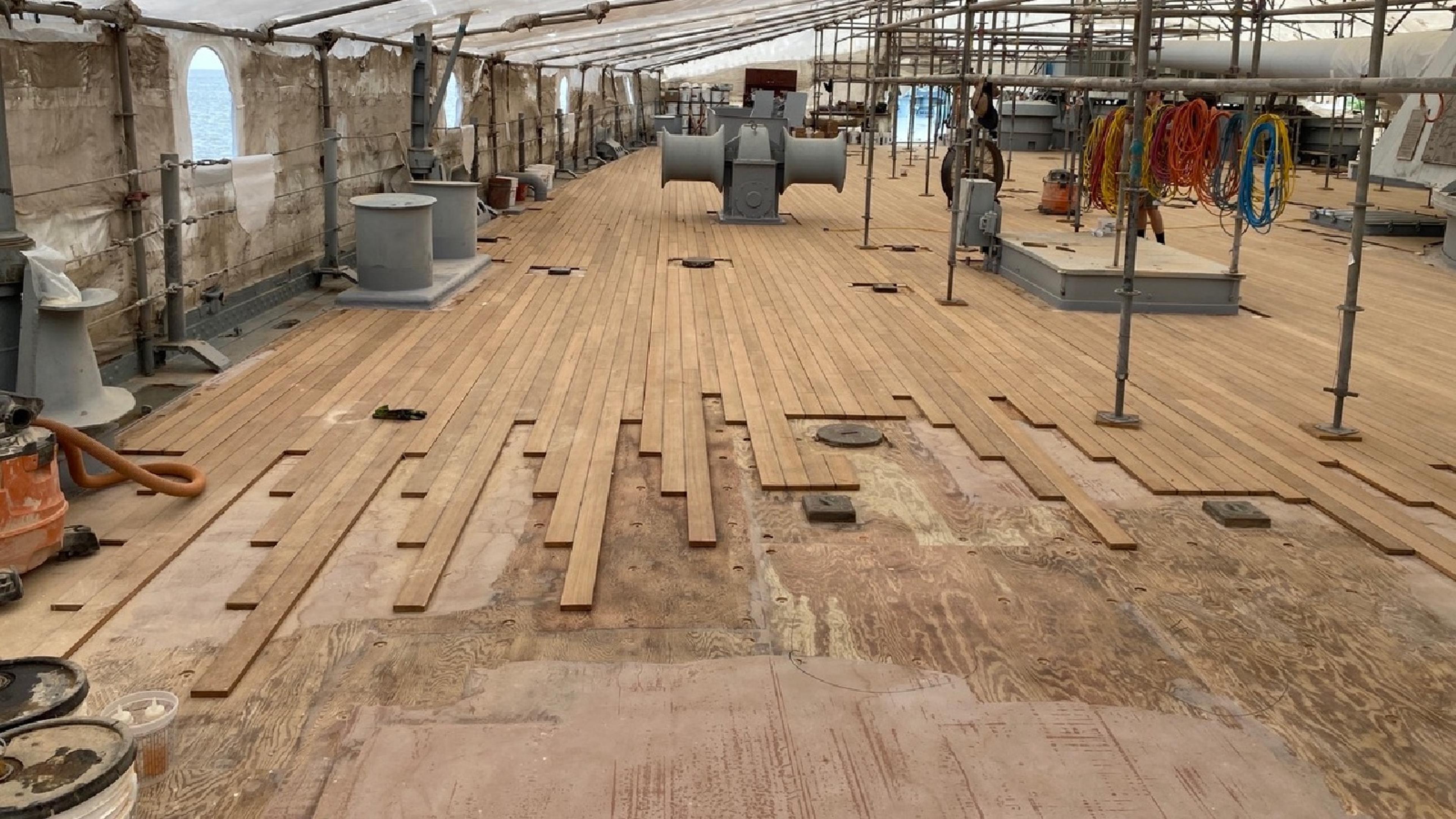 the deck of the USS Alabama with a layer of teak peeled off