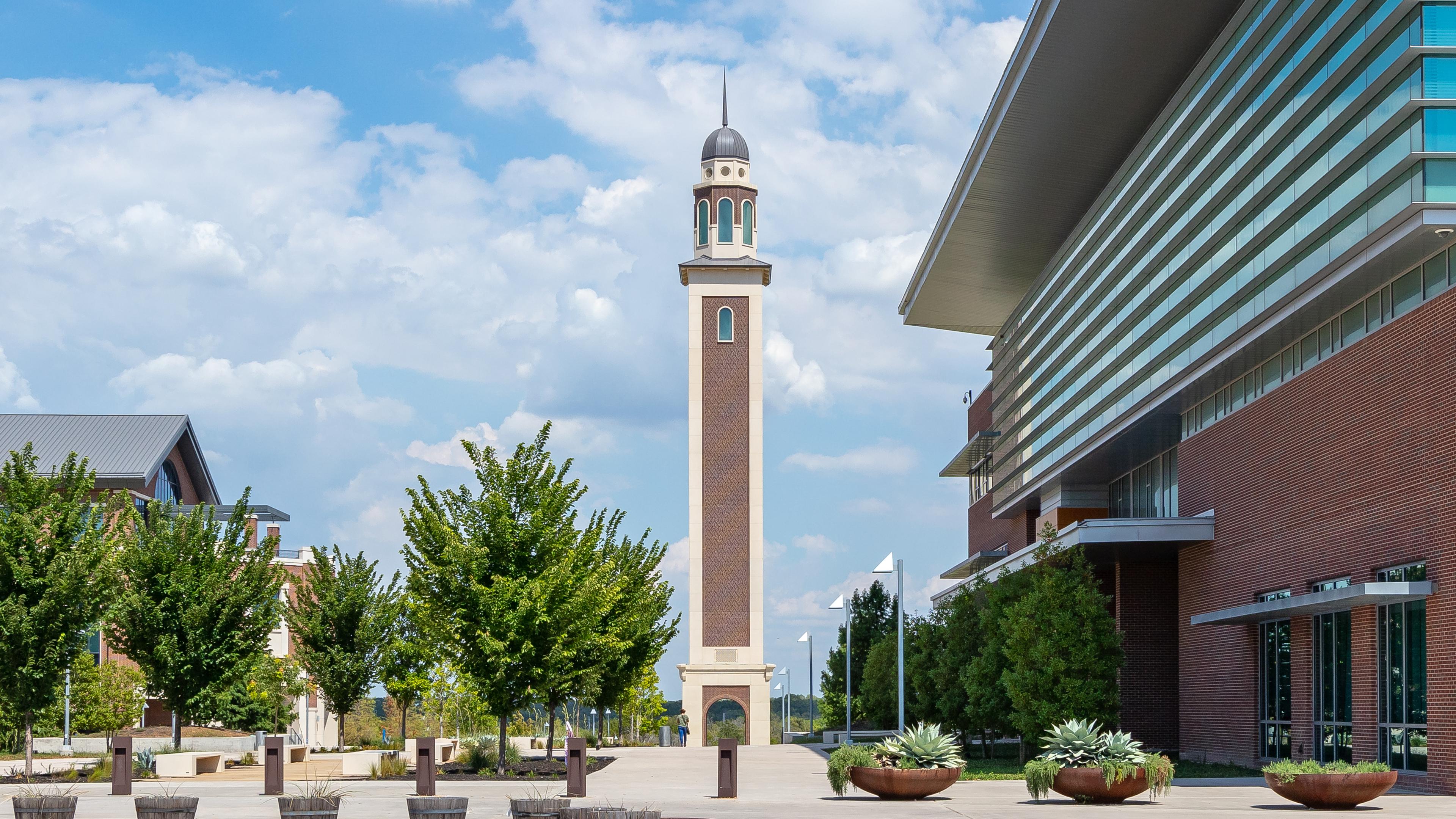 a bell tower on a university campus