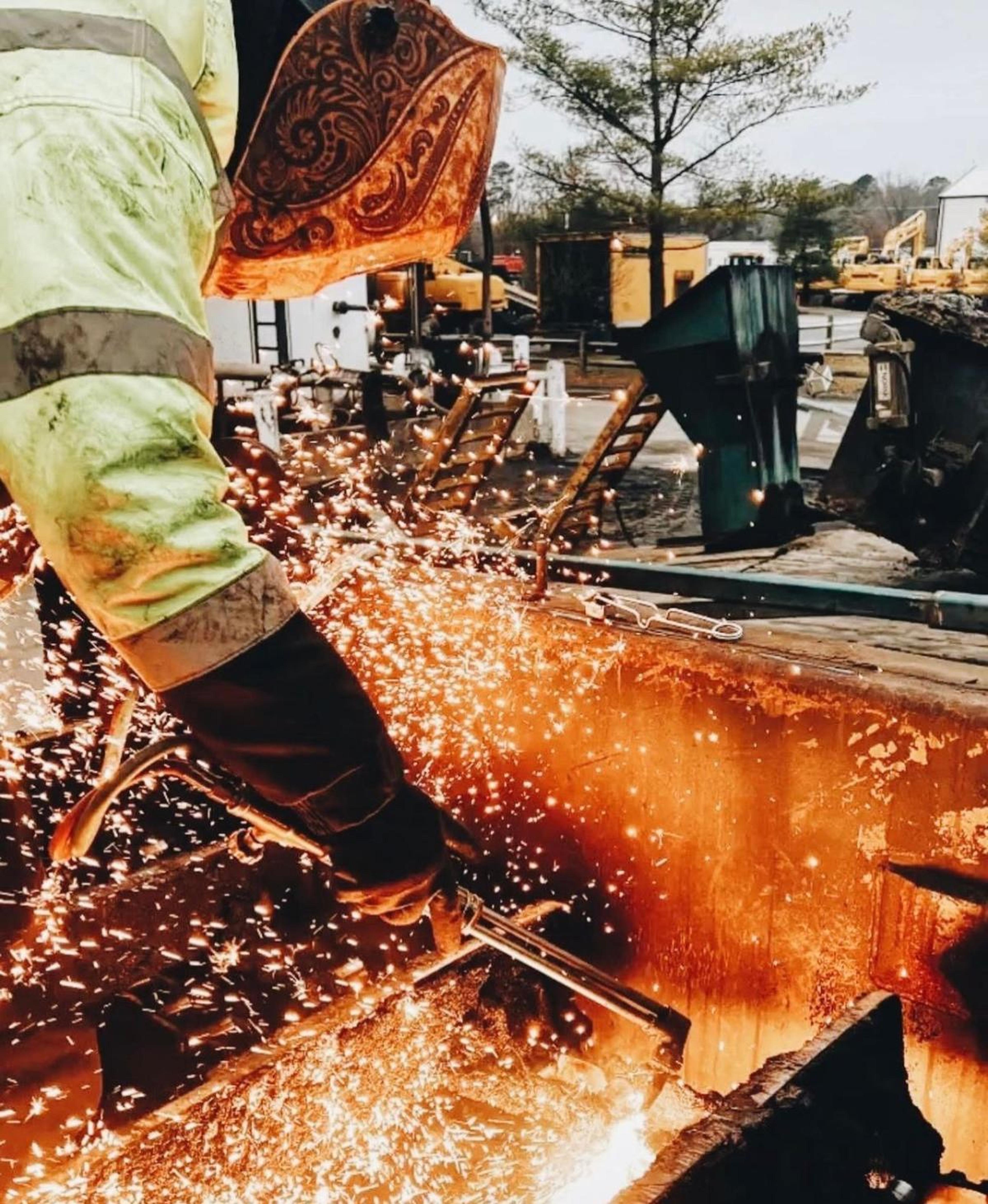a construction worker welding on a jobsite