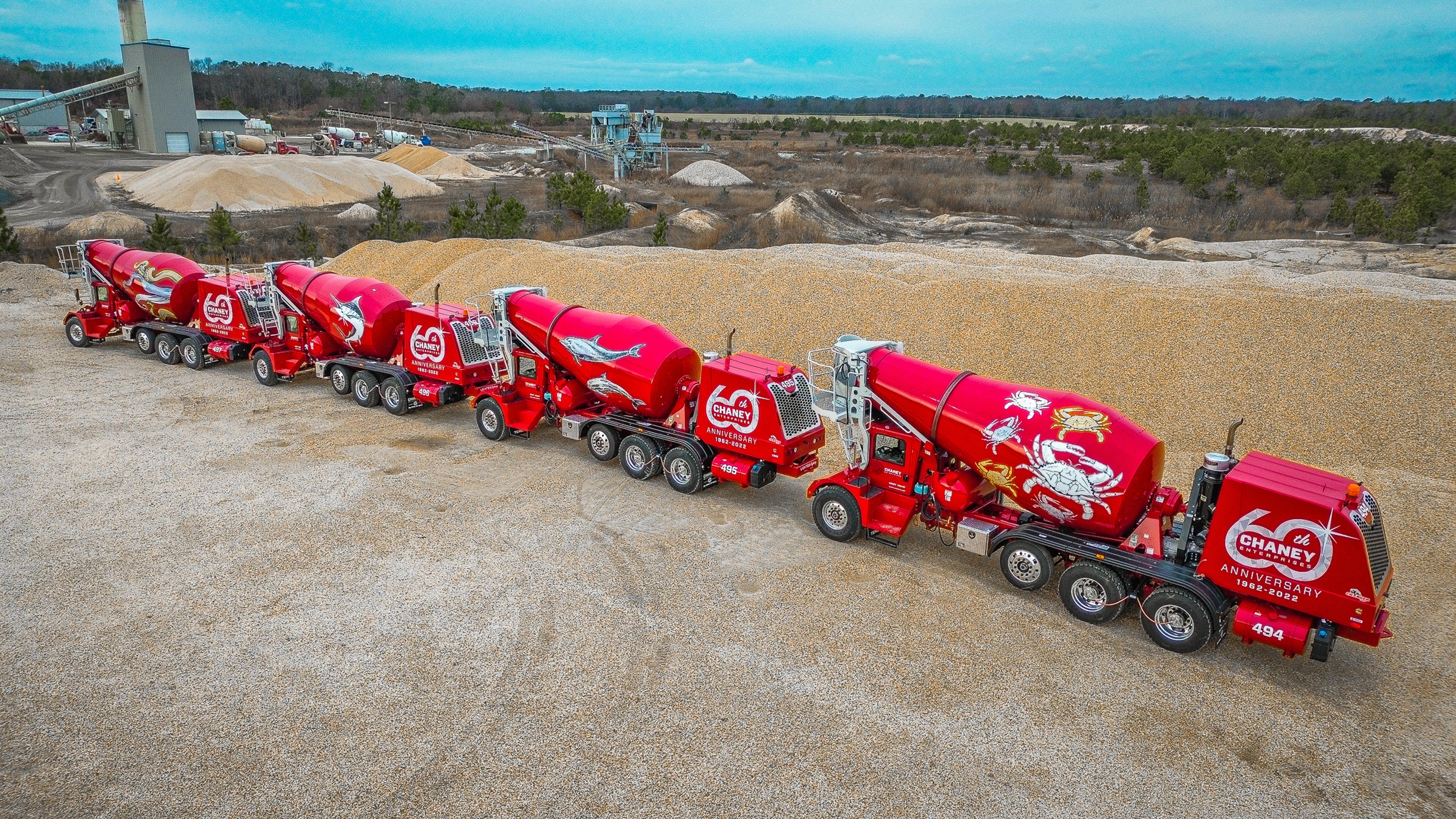 a series of cement trucks on a jobsite