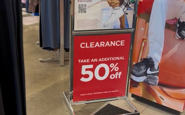 Retail sale banner advertising deep discounts on clothing and home goods