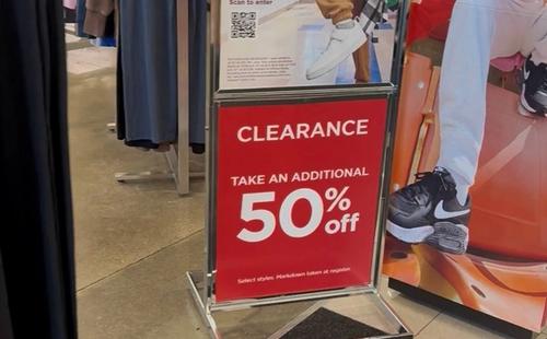 Retail sale banner advertising deep discounts on clothing and home goods