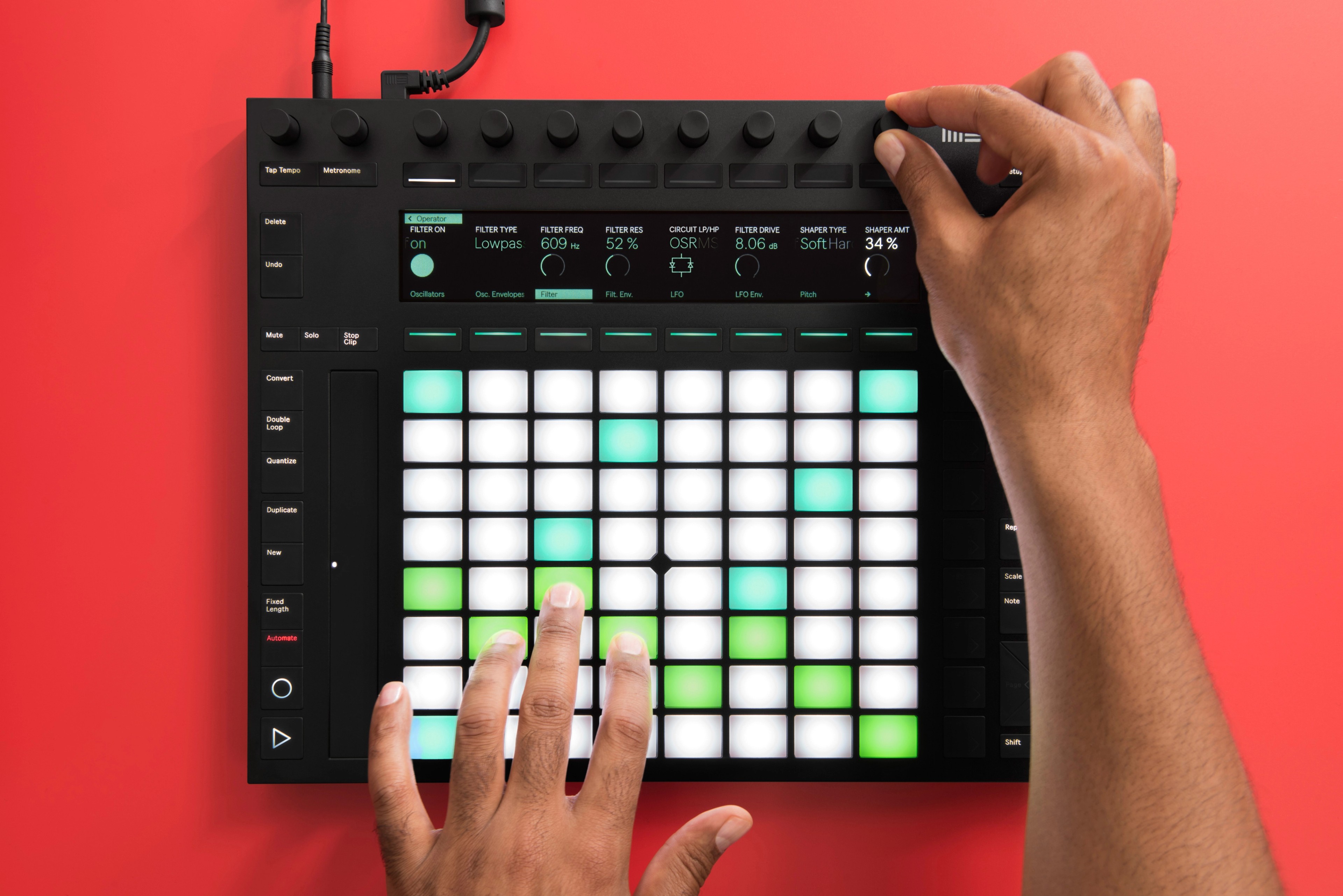 Image of hands playing an Ableton Push
