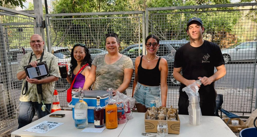 Volunteers serving drinks at a Yappy Hour