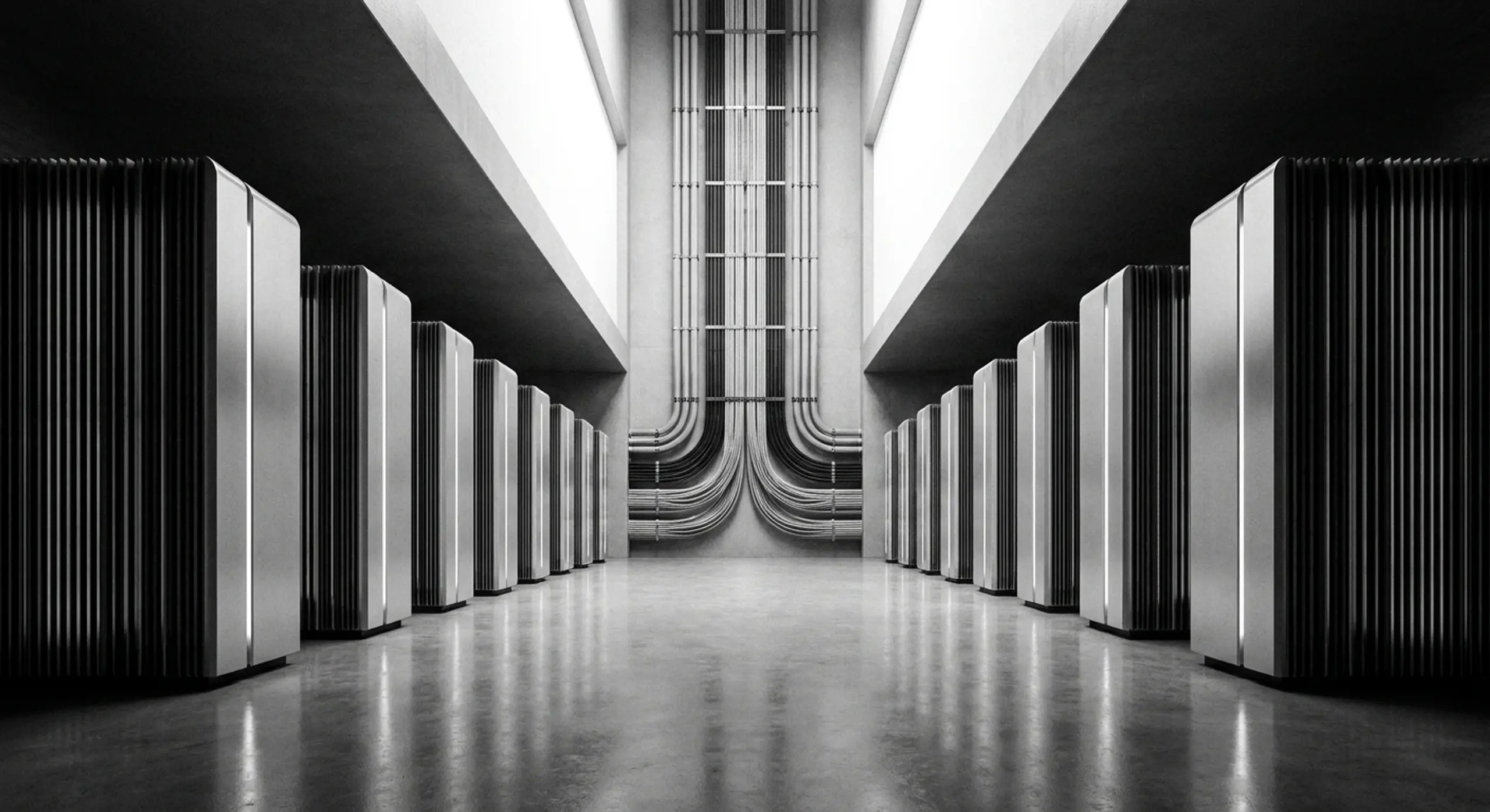 Black and white image of a data center aisle with rows of server racks and industrial pipes.