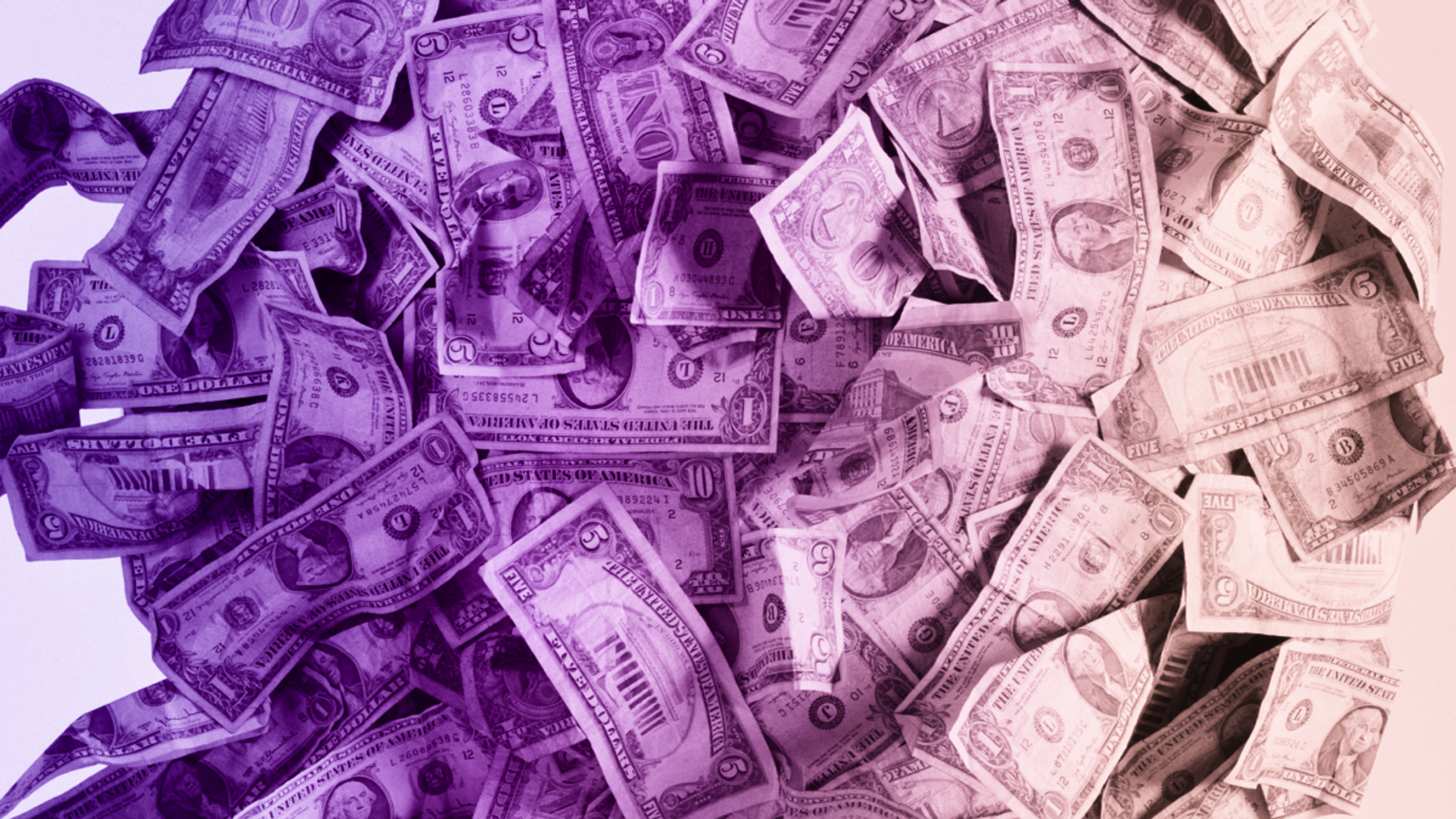 A heap of US dollar bills in various denominations, tinted with a vibrant purple-to-pink color gradient.