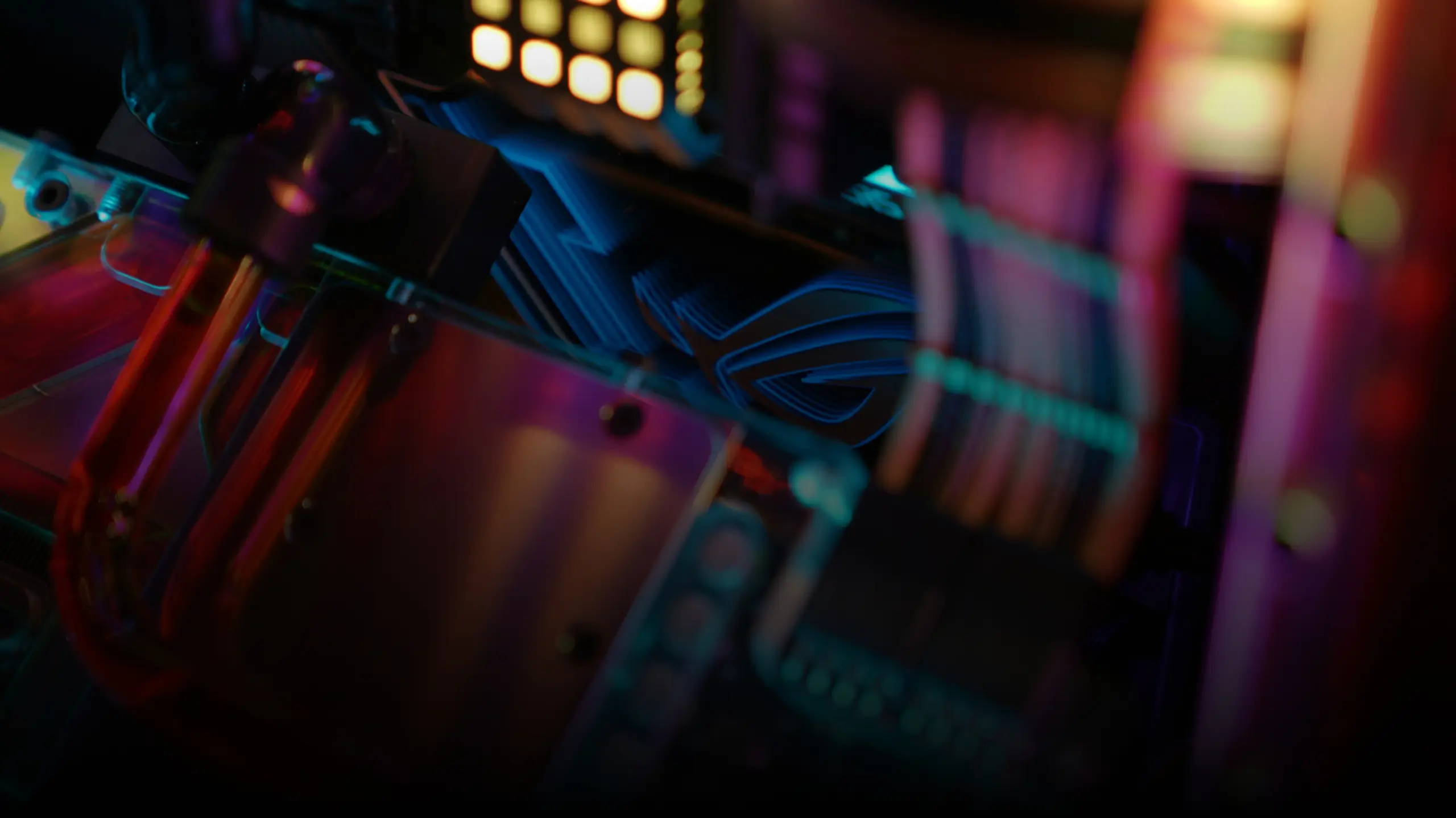 Red liquid cooling tubes, and colorful RGB lighting.