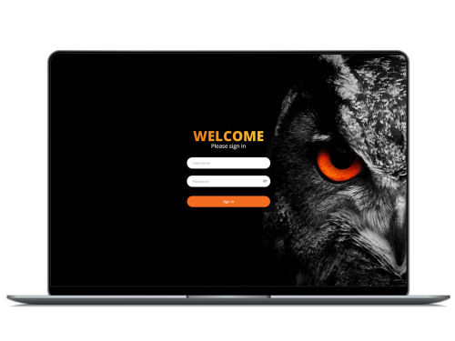 a laptop displays a welcome page with an owl on the screen