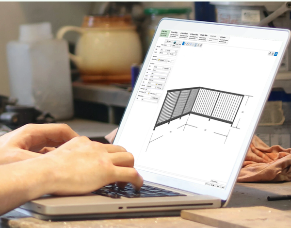 a person is typing on a laptop with a drawing of a railing on the screen a person is typing on a laptop with a drawing of a railing on the screen