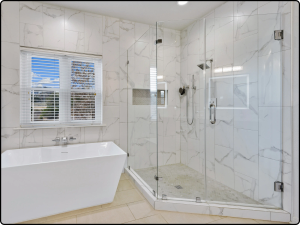 image of a bathroom with a walk in frameless shower