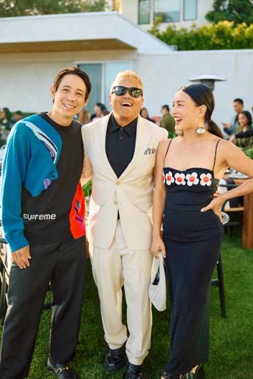 Guests laughing at an outdoor private dinner covered by The Lounge Booth