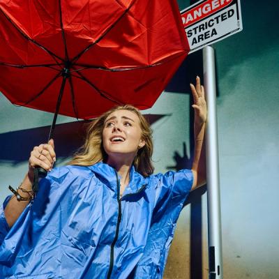 Professional event photographer directing a guest on set