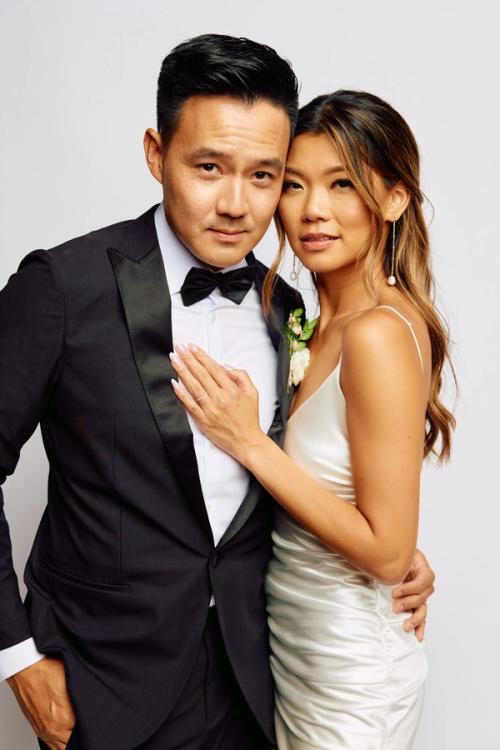 Joyful wedding couple laughing together — professional reception photography by The Lounge Booth