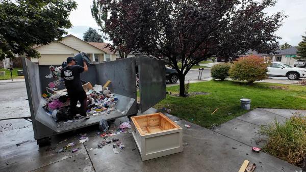 Top Shelf crew loading a trailer during a house cleanout