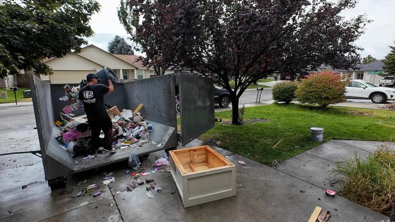 Top Shelf crew loading a trailer during a house cleanout in Meridian Idaho