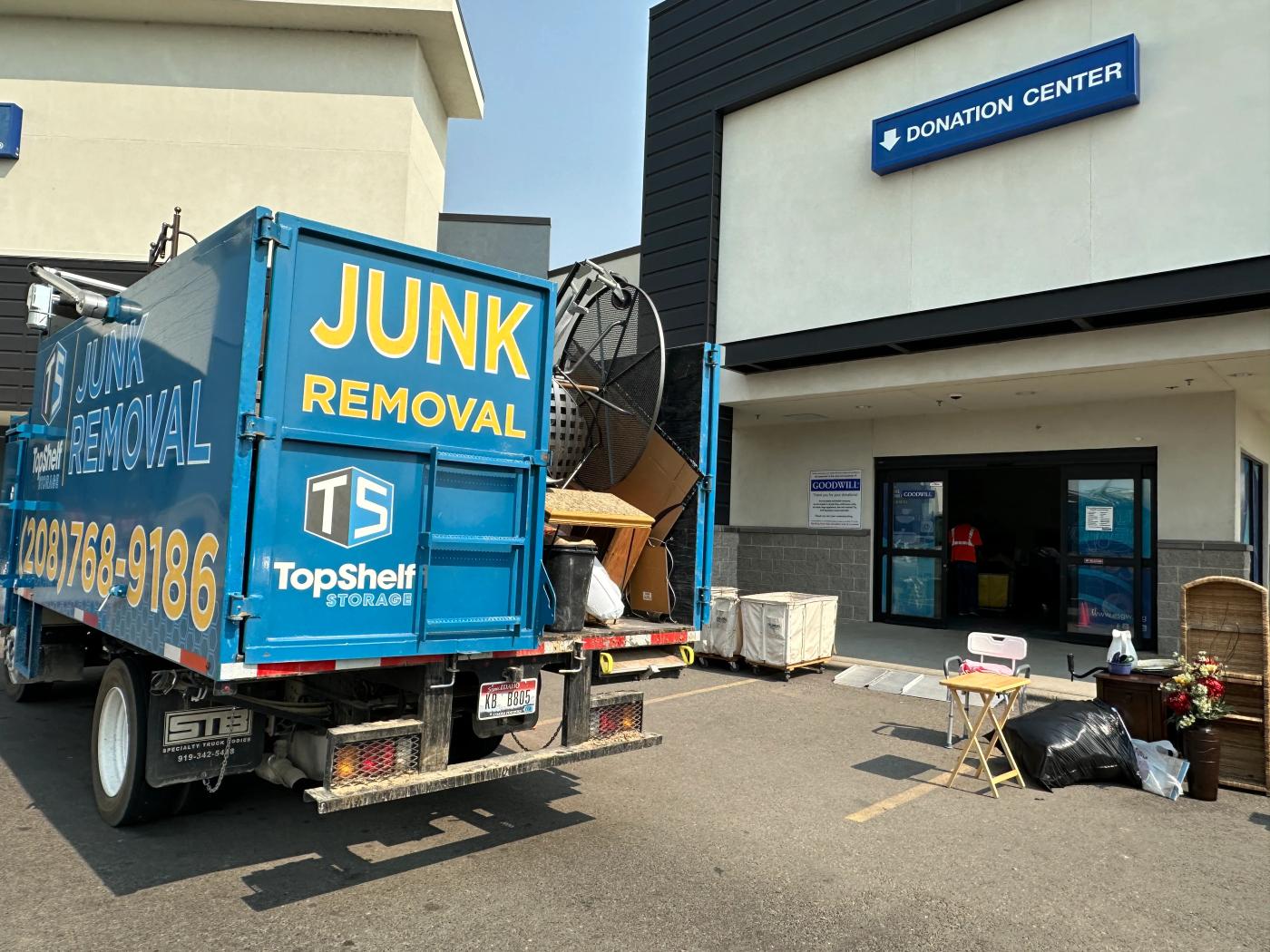 Top Shelf junk removal truck loaded with donation items at Goodwill in Nampa Idaho