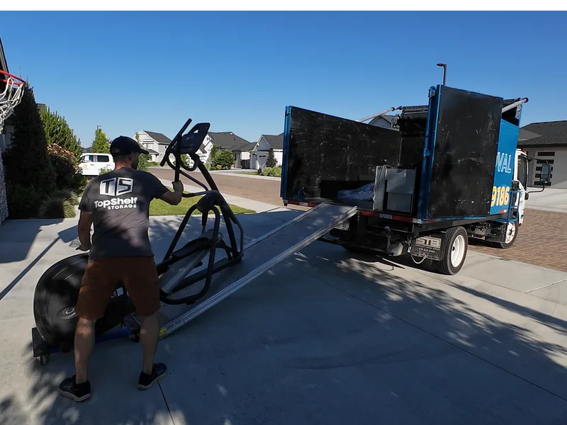 Top Shelf crew removing an elliptical machine in Meridian Idaho
