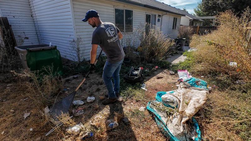 Top Shelf crew raking during a yard cleanout in Emmett Idaho