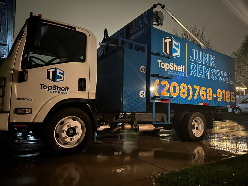 Top Shelf junk removal truck on site for an evening drywall debris pickup in Kuna Idaho