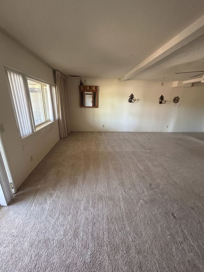 After: the same estate-cleanout room, emptied and swept by Man of Steel Junk Removal