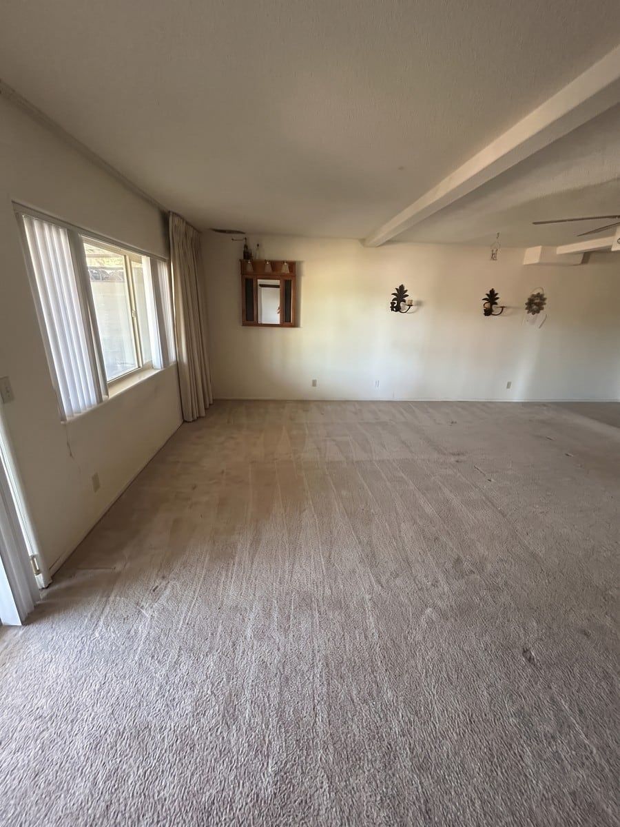 After: the same estate-cleanout room, emptied and swept by Man of Steel Junk Removal
