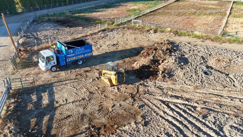 Aerial view of manure removal with skid steer and truck in Caldwell Idaho