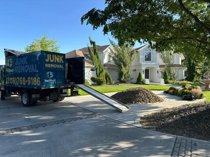 Top Shelf branded truck loaded with bushes during removal in Eagle Idaho