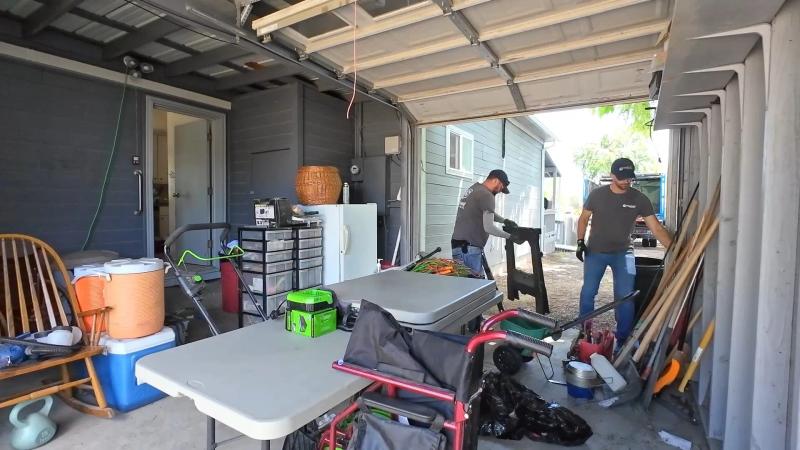 Sorting household items into keep donate and toss piles during a home cleanout in the Treasure Valley
