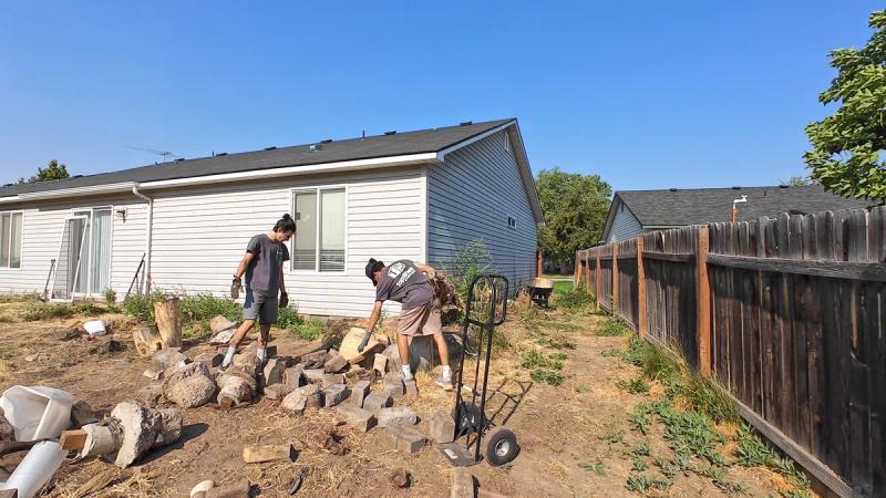 Top Shelf crew removing concrete rubble and wood stumps during a land clearing project in Meridian Idaho