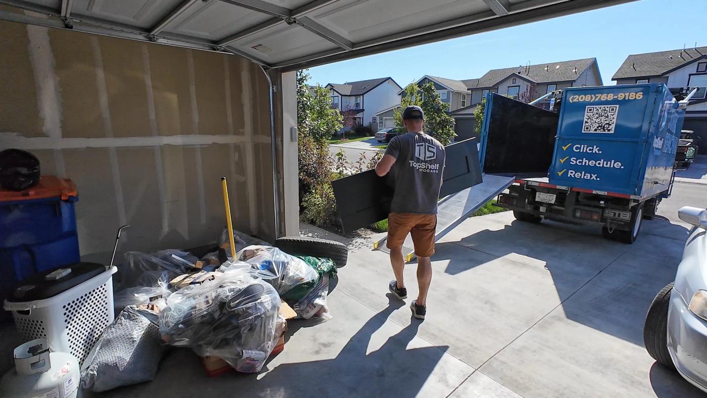 Top Shelf crew sorting items during a garage cleanout in the Boise Idaho area
