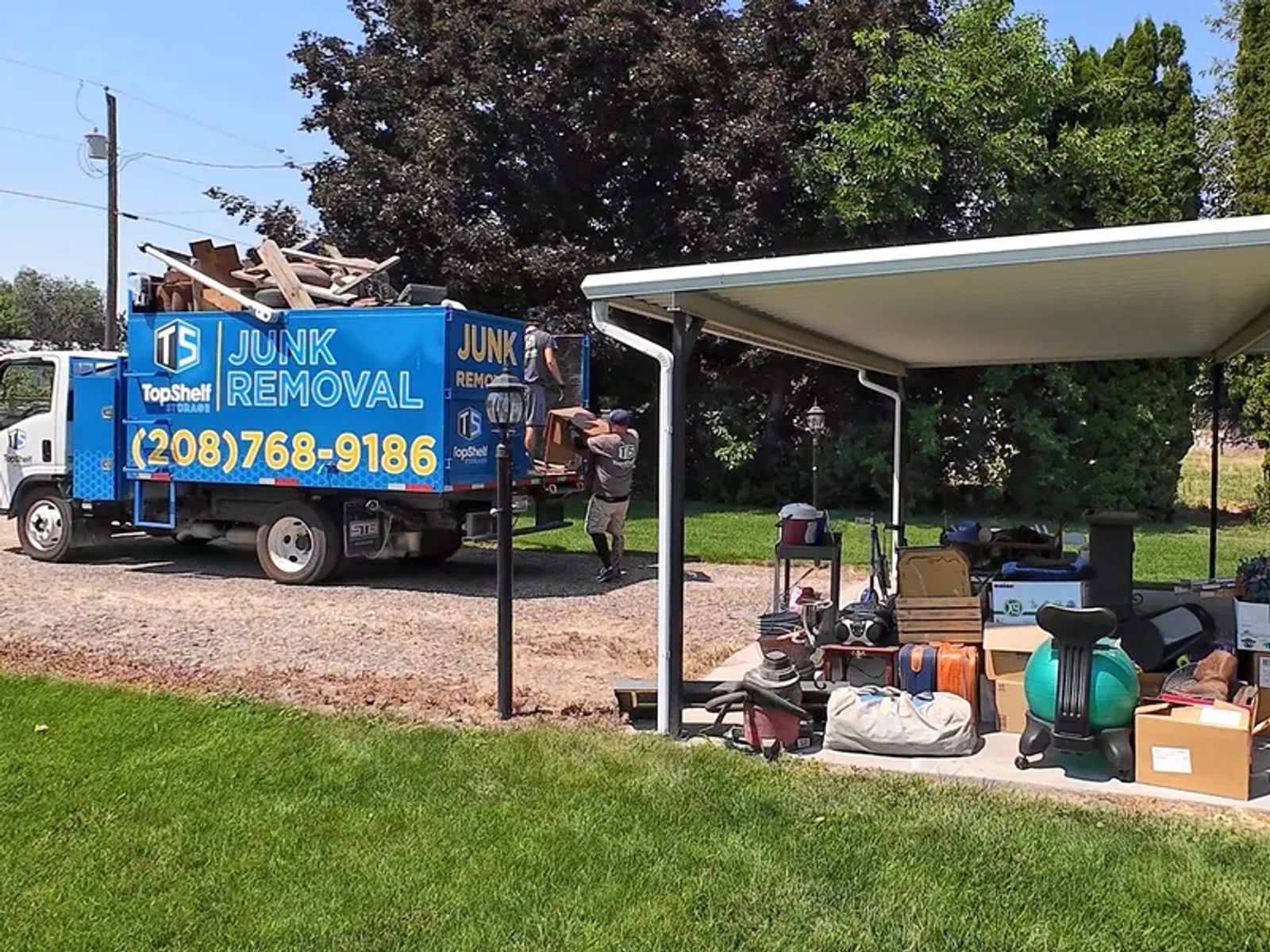 Top Shelf cleanout crew loading household items from a property cleanout in Boise Idaho