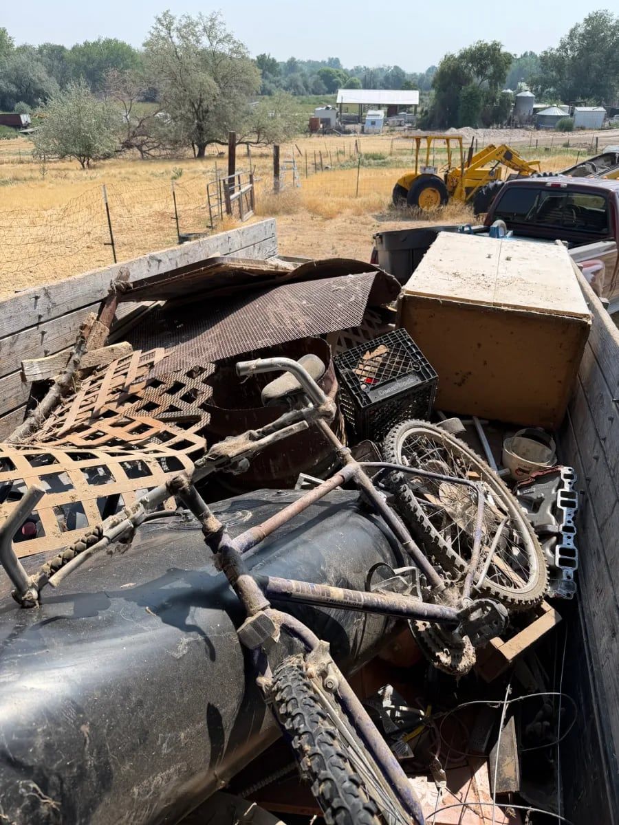 Trailer of scrap metal, bikes and yard junk