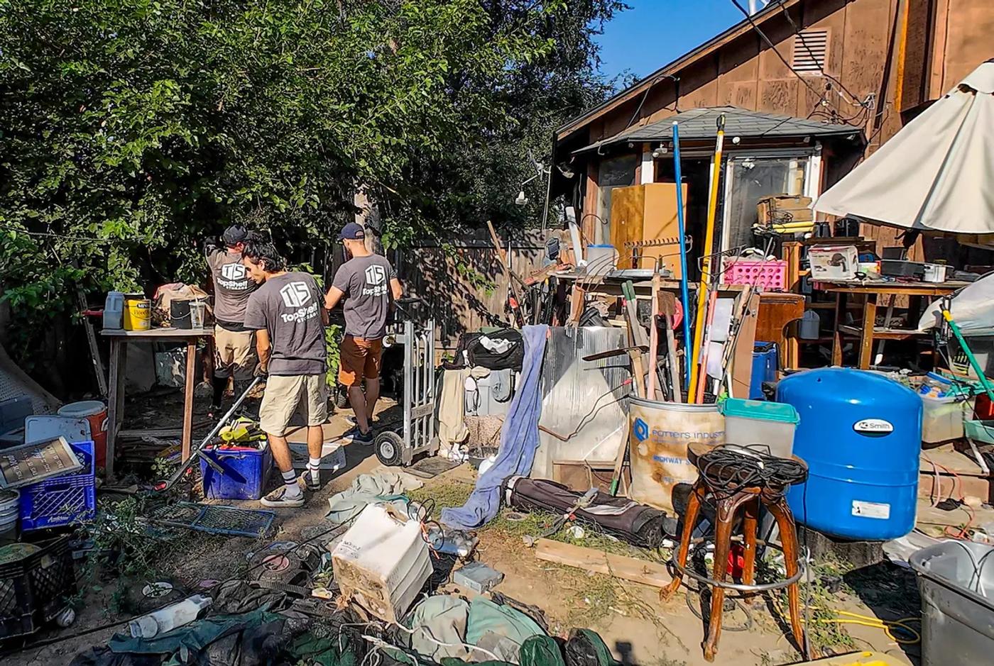 Top Shelf crew performing a hoarding cleanup at a backyard property in Boise Idaho