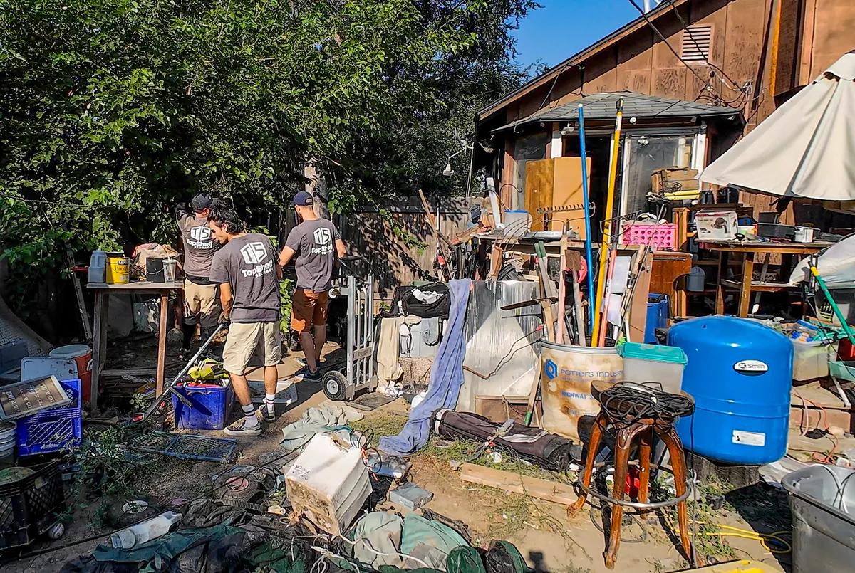 Top Shelf crew performing a hoarding cleanup at a backyard property in Boise Idaho