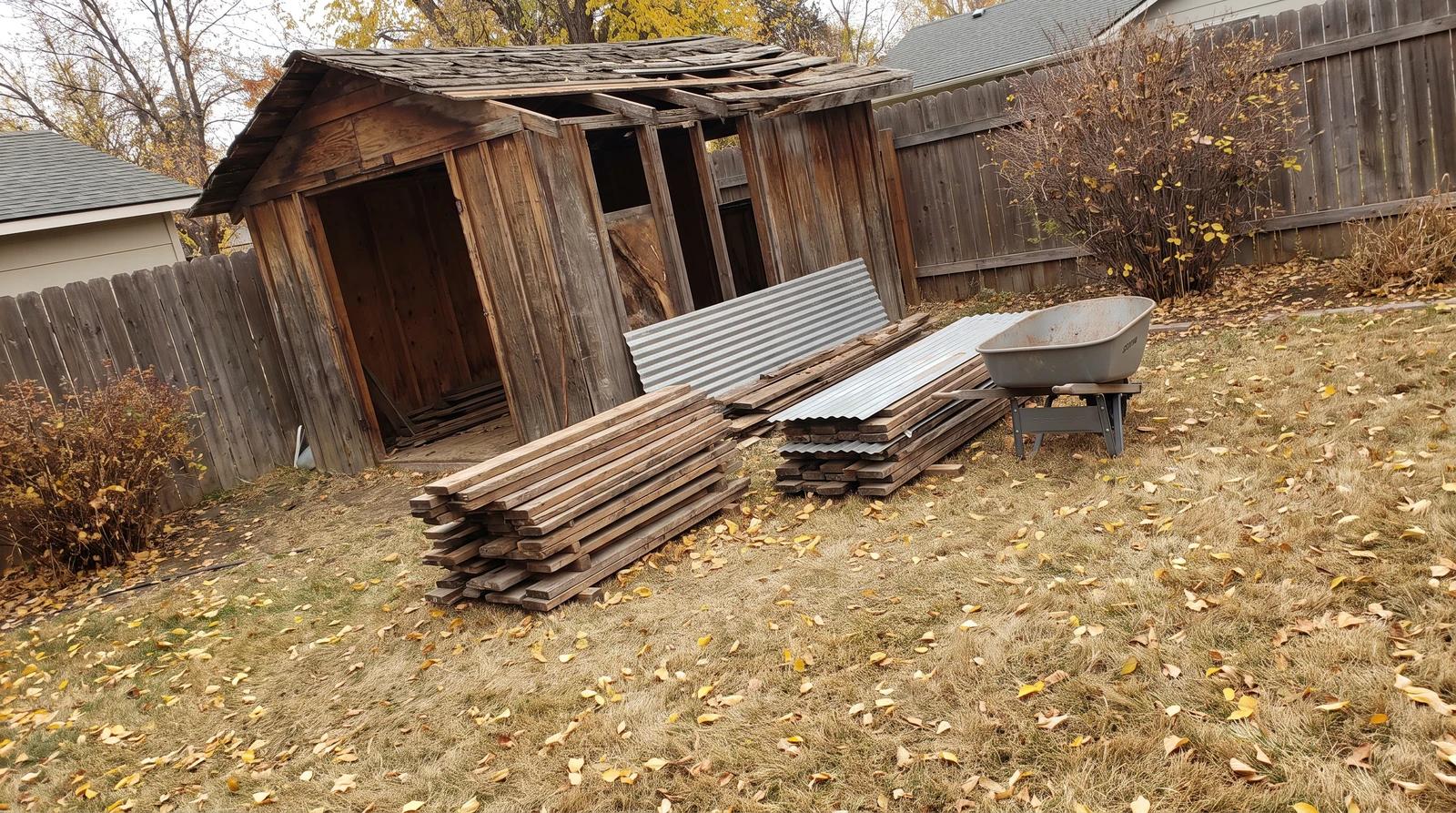 Old wooden shed with a sagging roof in a fall backyard in Nampa, Idaho, waiting for shed demolition